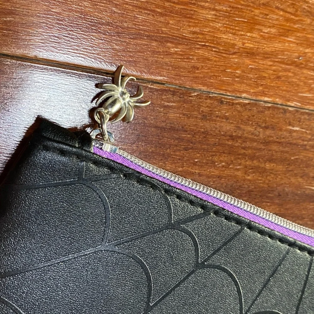 5 ipsy bags including spider web